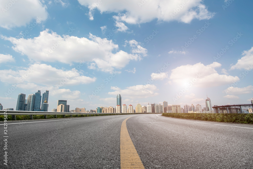 Fototapeta premium Empty asphalt road along modern commercial buildings in China,s cities