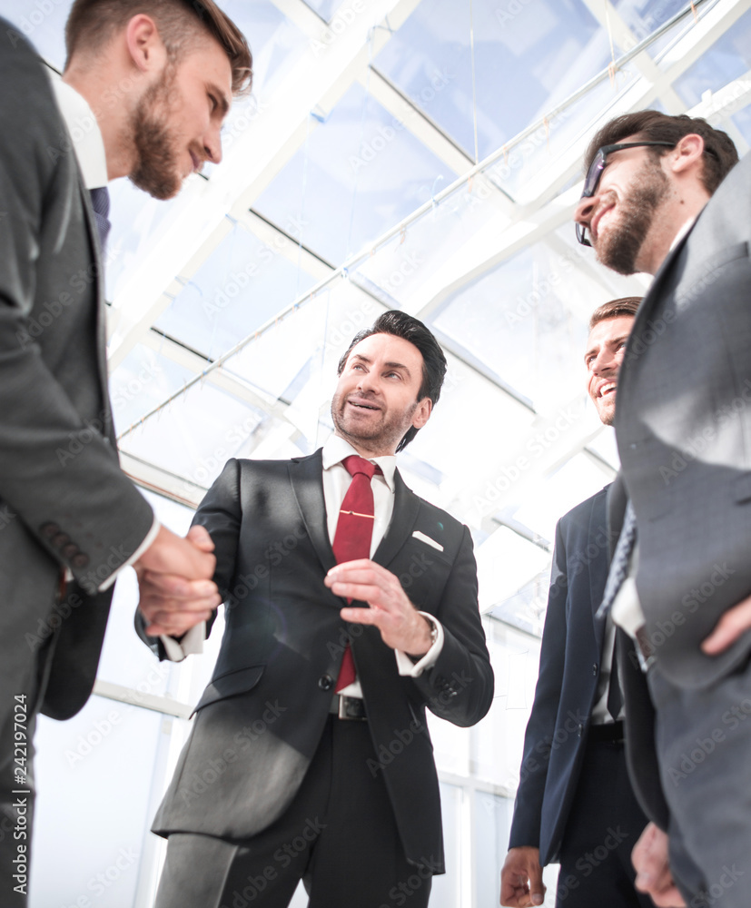 handshake business partners standing in the office handshake business partners standing in the office