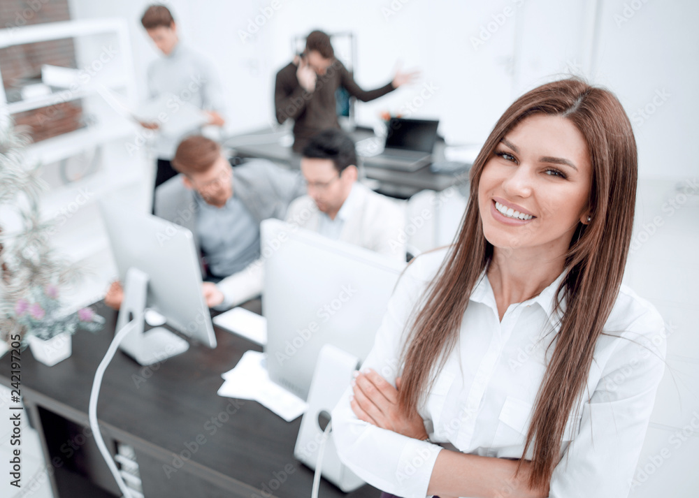 smiling businesswoman standing in a modern office smiling businesswoman standing in a modern office