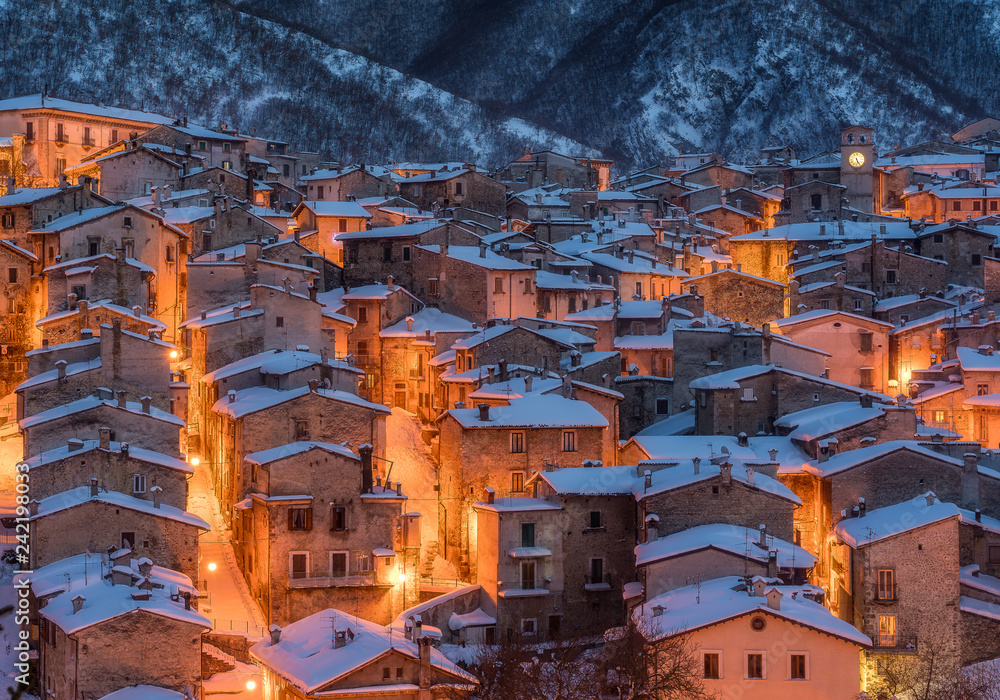 The beautiful Scanno covered in snow during a cold winter evening. Abruzzo, central Italy.