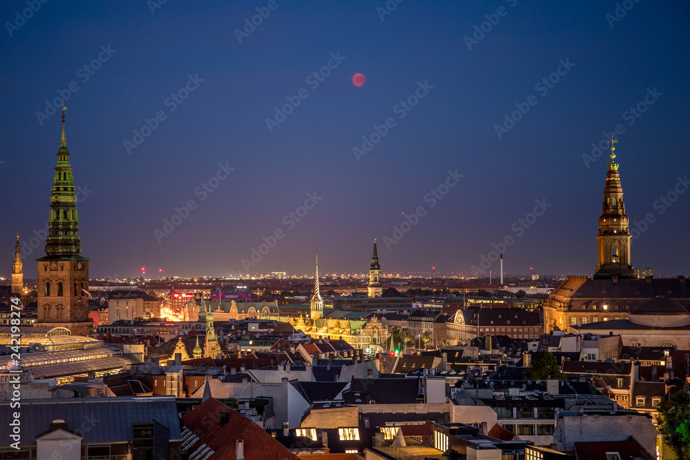 Copenhagen Skyline with Lunar Eclipse in the Night Sky and the Towers of  Christiansborg Palace and St. Nicholas Church, shot from Rundetårn - Copenhagen, Denmark