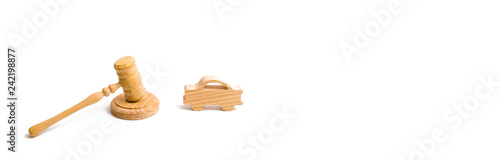 Wooden figurine of a car in the hammer of a judge on a white background. Purchase and sale of the car. The trial, confiscation of the machine. Recognition of ownership. Minimalism. banner
