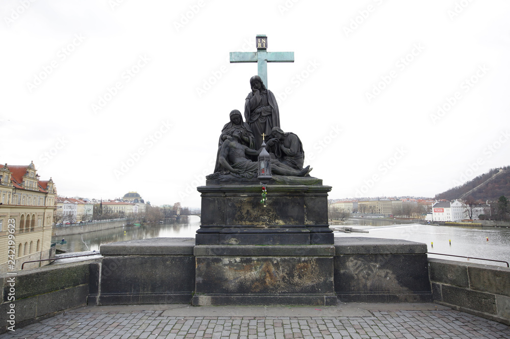 Statue of Pieta aka. Lamenting of Christ  on Charles bridge, Prague, Czech Republic