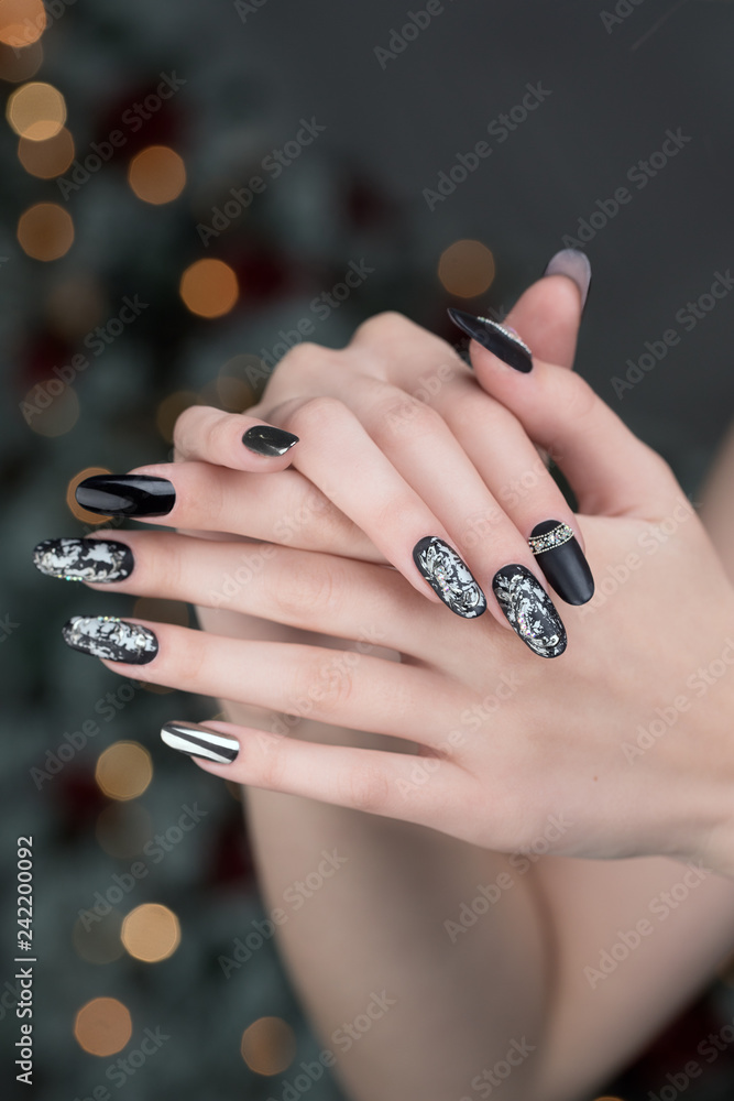 Close up on beautiful female hands with Nail Art manicure. Close up on beautiful female hands with Nail Art manicure.