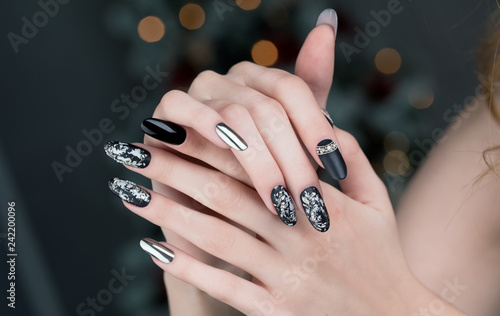 Close up on beautiful female hands with  Nail Art  manicure.
