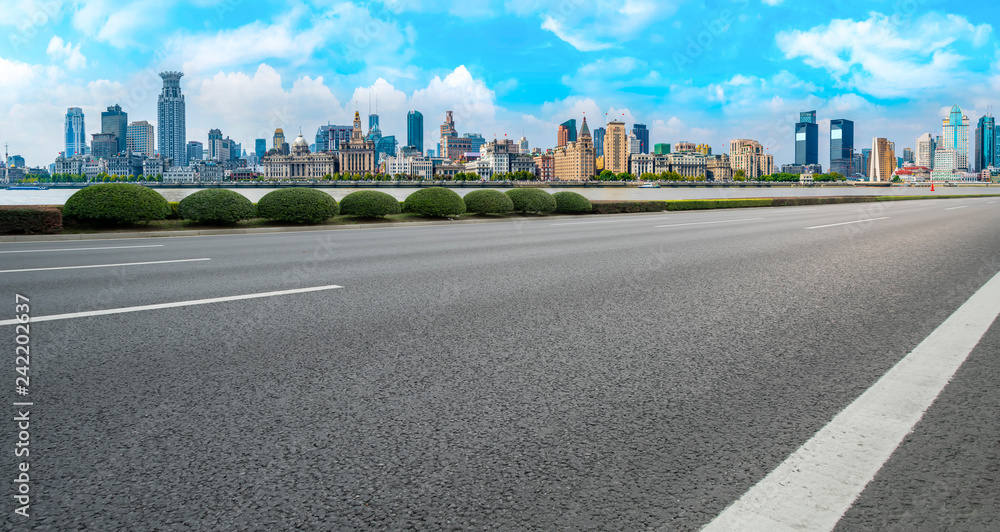 Empty asphalt road along modern commercial buildings in China,s cities