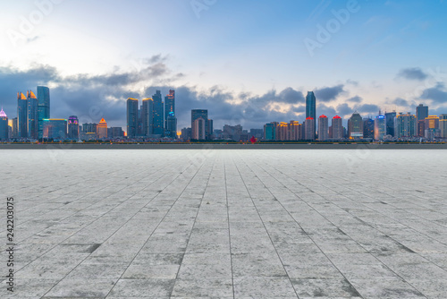 Empty marble floors and city views under the blue sky © 昊 周