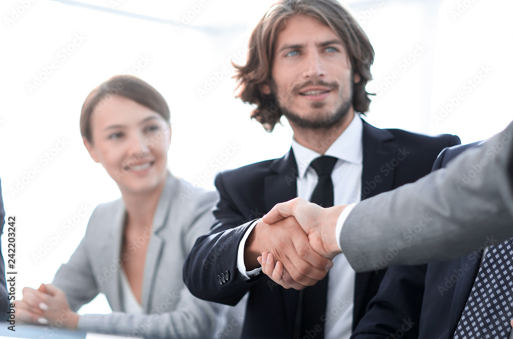 background image of handshake of business partners background image of handshake of business partners