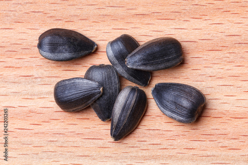 Sunflower seeds on wooden background. Close-up.