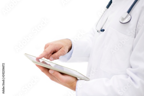 Doctor using digital tablet photo