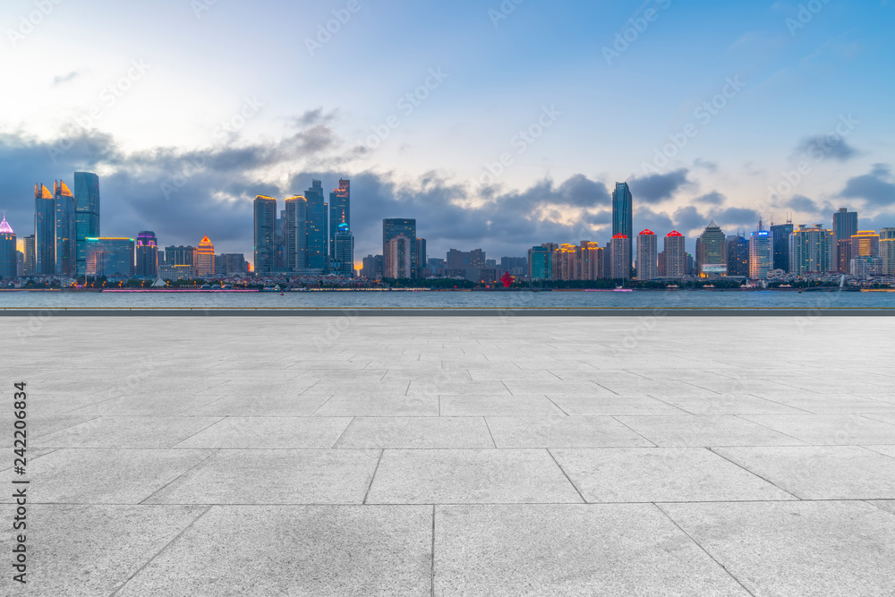 Empty marble floors and city views under the blue sky