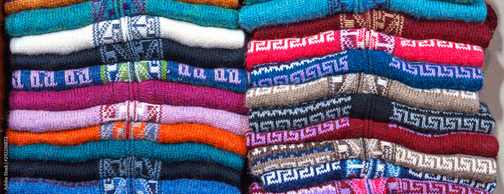 Peruvian traditional colourful native handicraft textile fabric at market in Peru, South Americain. Close up. selective focus