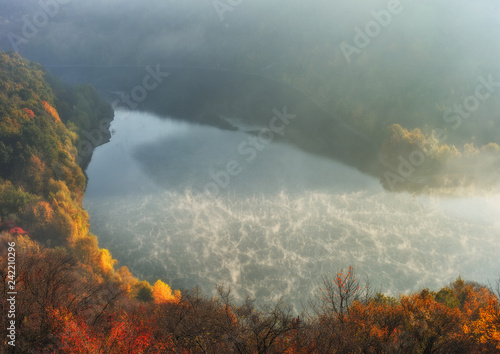 fog over the canyon of the picturesque river. autumn morning in national park © sergnester