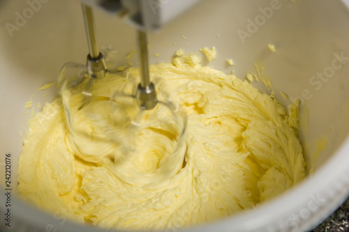 Shaking cake dough with an electric mixer