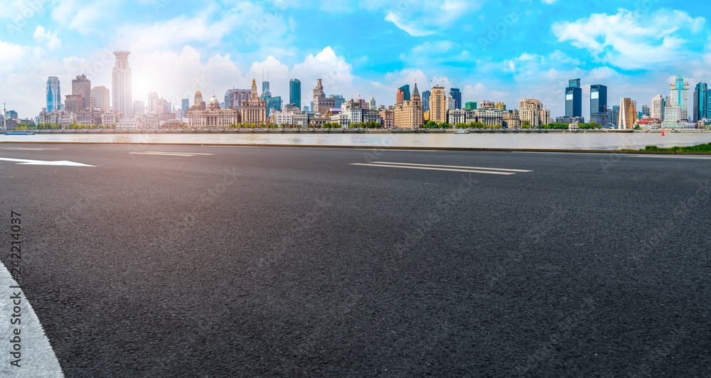 Naklejka premium Empty asphalt road along modern commercial buildings in China,s cities