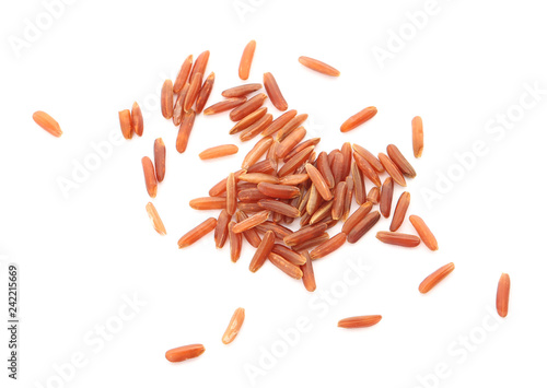 Uncooked red rice on white background, top view