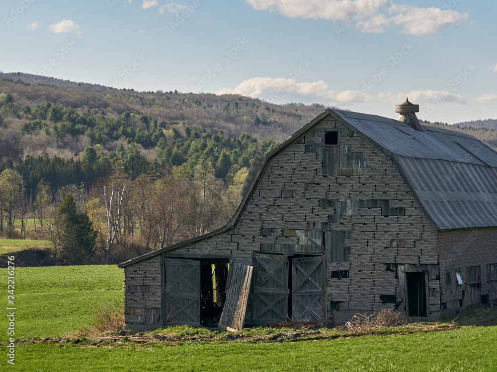 old barn in field