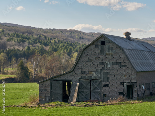 old barn in field