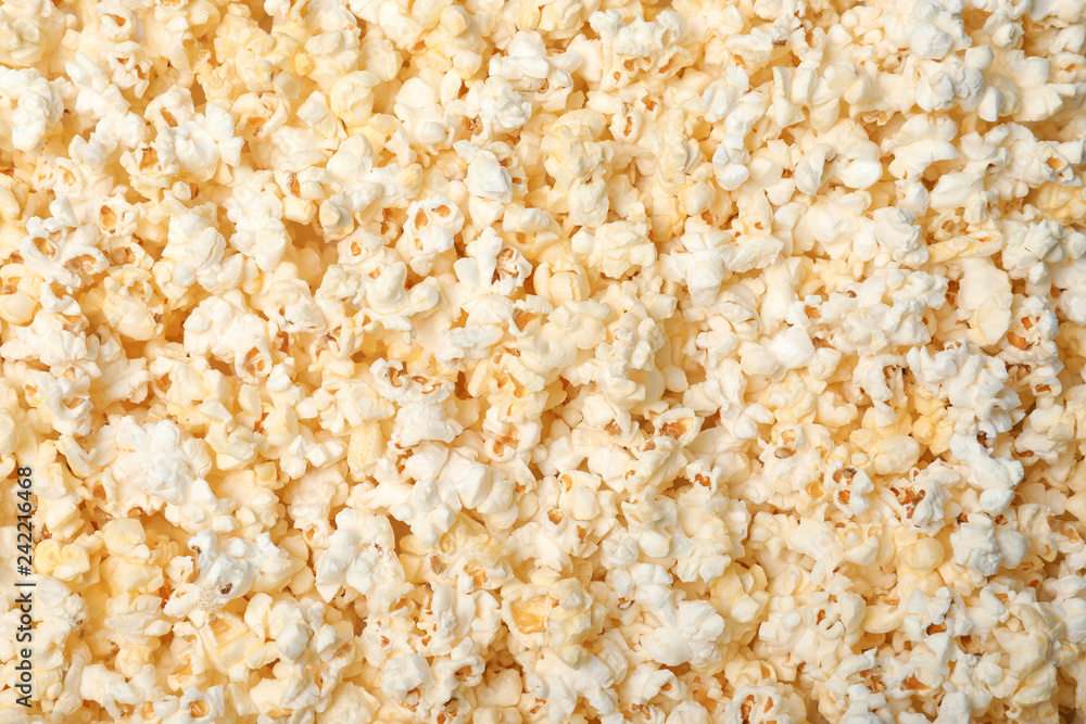 Fresh tasty popcorn as background, top view Fresh tasty popcorn as background, top view