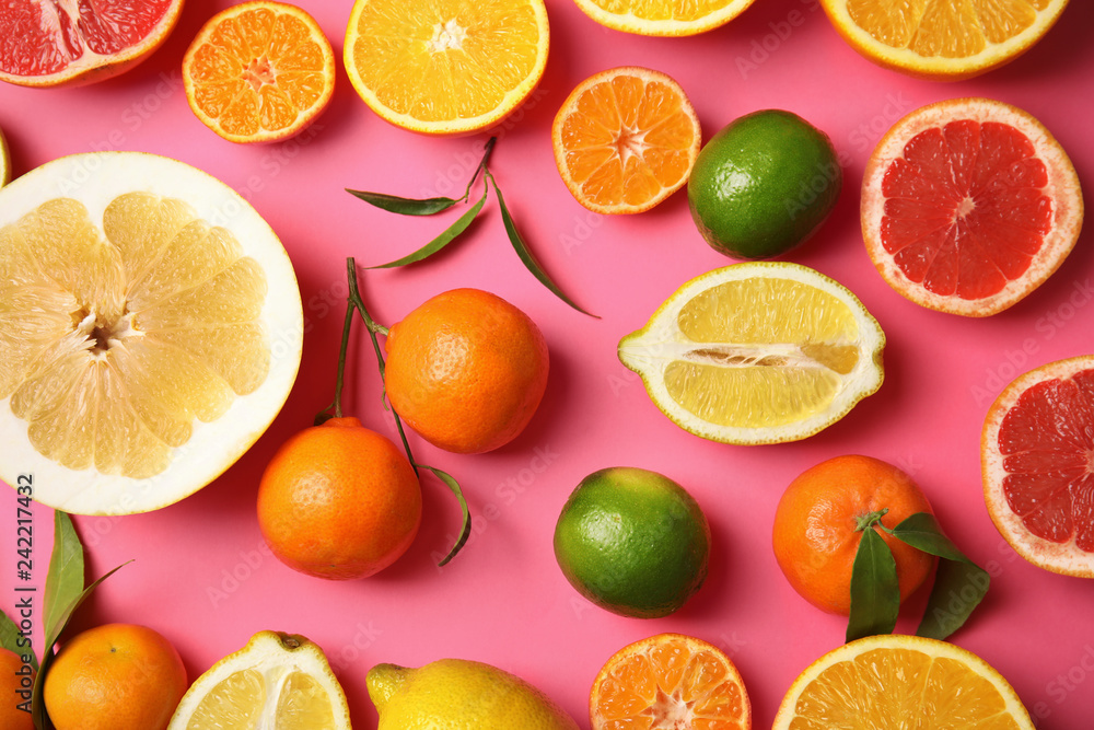 Different citrus fruits on color background, top view Different citrus fruits on color background, top view