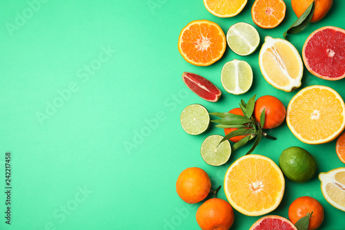 Fototapeta Naklejka Na Ścianę i Meble -  Different citrus fruits on color background, top view. Space for text