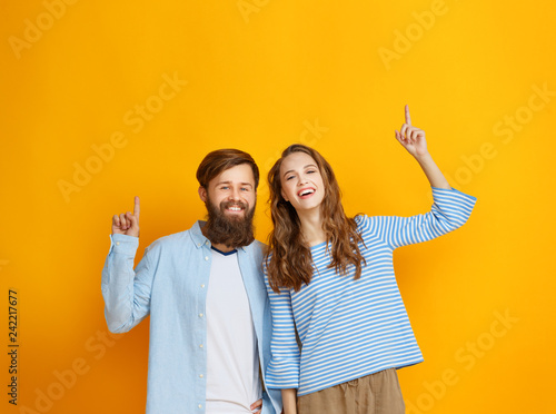 couple of emotional people man and woman on yellow background.