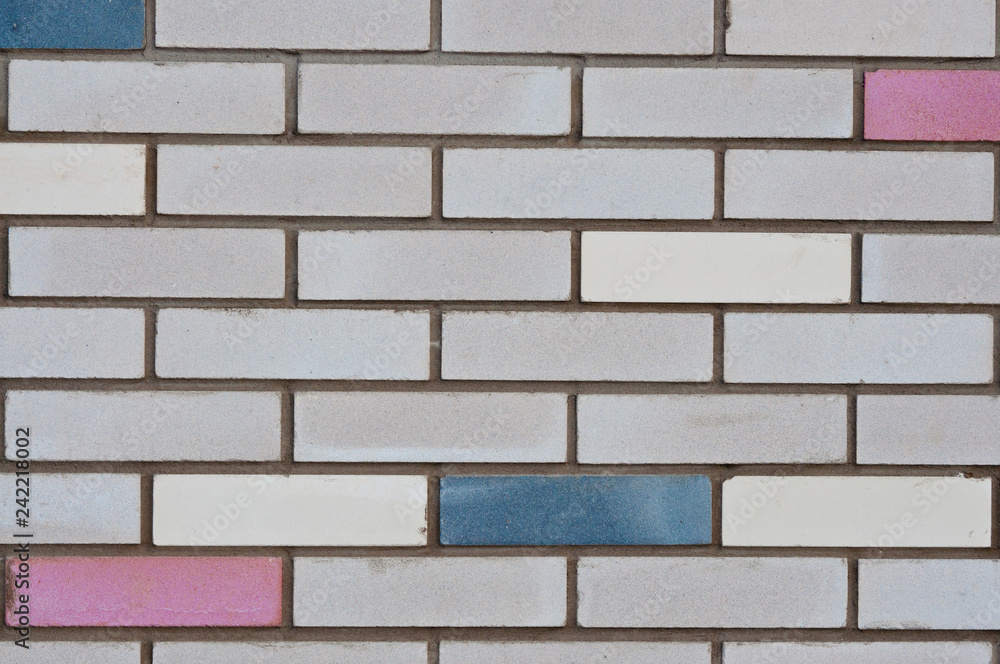 Obraz premium Brick wall with colored bricks. City backgrounds.