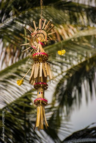 Beautiful Decorative Balinese Penjor. Penjor are tall tapered poles made from bamboo and placed outside Balinese Hindu homes during certain religious holidays such as Galungan and Kuningan. photo