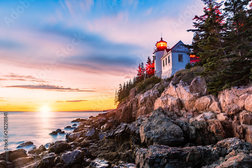Bass Harbor Head lighthouse at sunset. Bass Harbor Head Light is a lighthouse located within Acadia National Park, Maine, marking the entrance to Bass Harbor and Blue Hill Bay photo