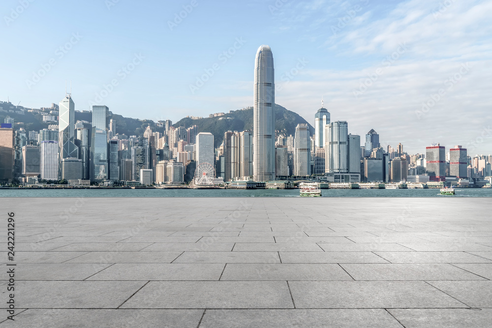 Empty marble floors and city views under the blue sky