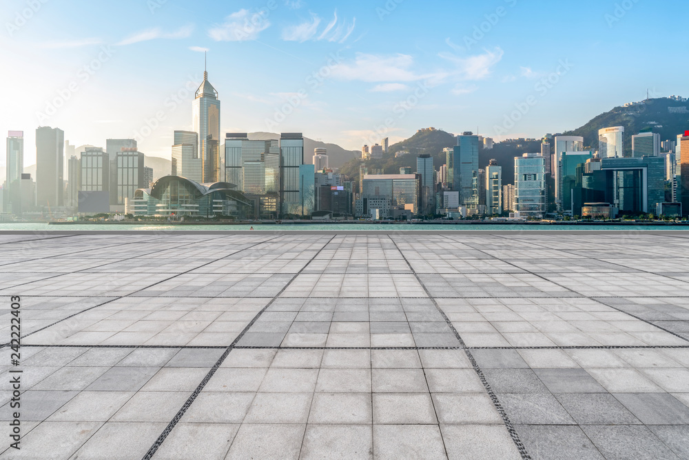 Empty marble floors and city views under the blue sky