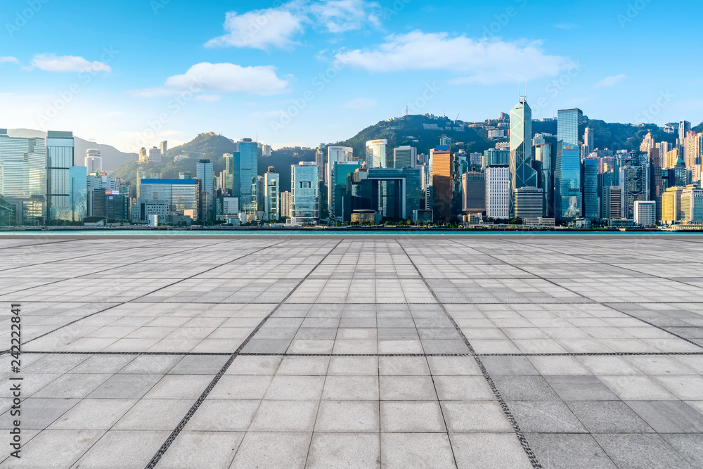 Empty marble floors and city views under the blue sky