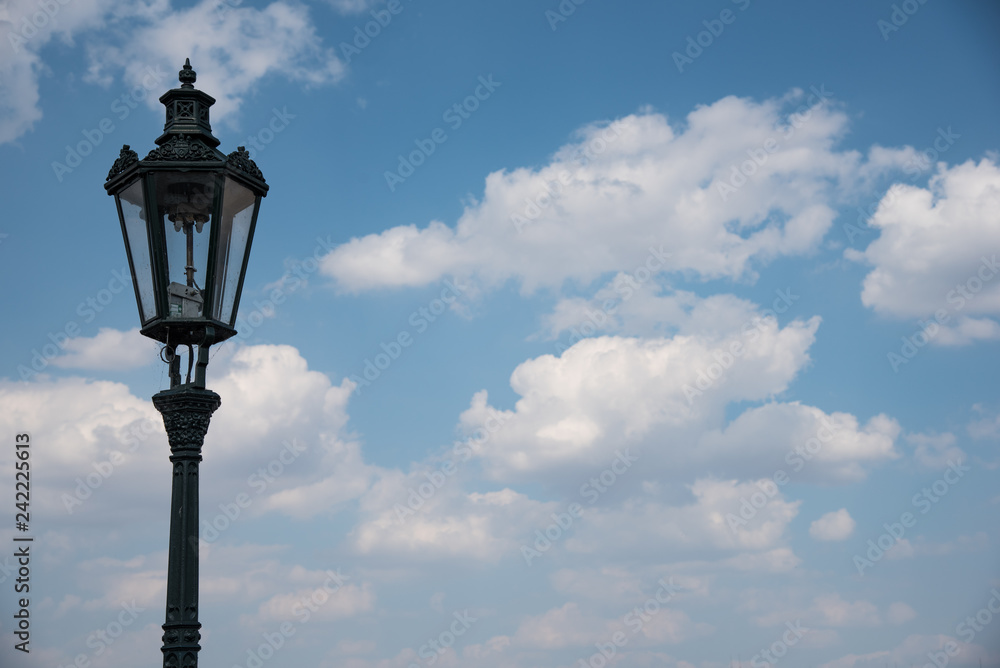 Street lamp with blue cloudy sky