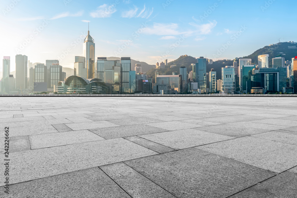 Empty marble floors and city views under the blue sky Empty marble floors and city views under the blue sky