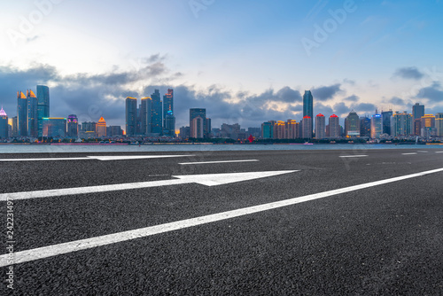 Empty asphalt road along modern commercial buildings in China s cities