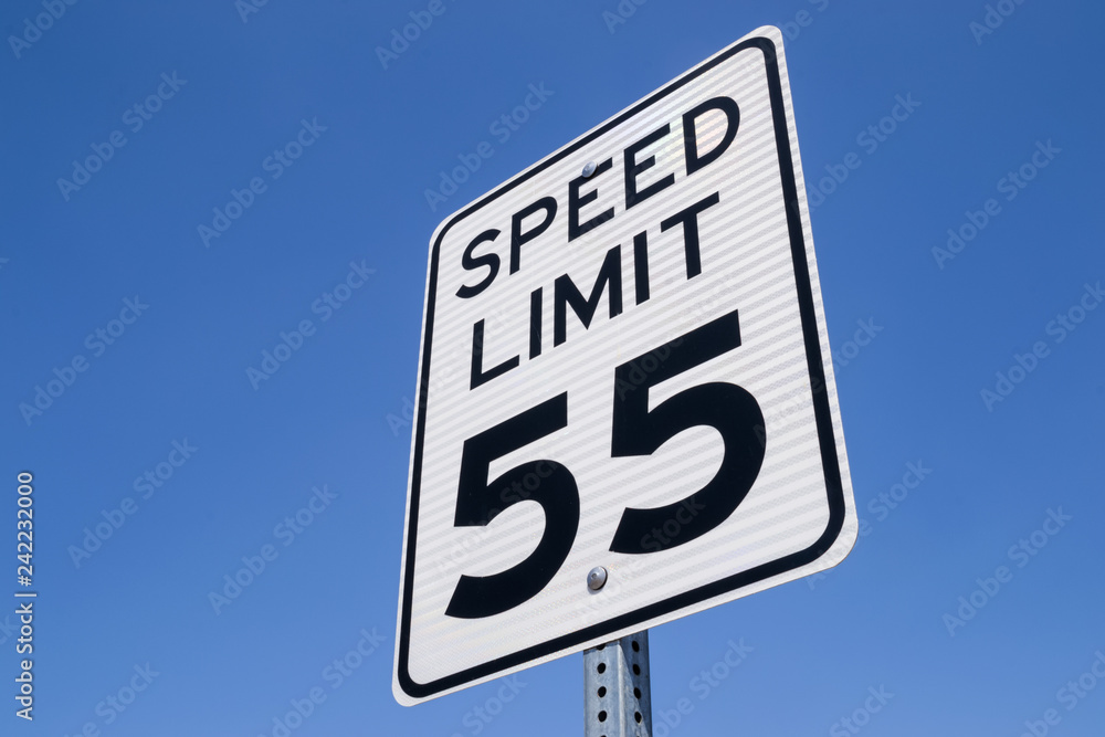 The fifty-five miles per hour street sign in the California sun. The fifty-five miles per hour street sign in the California sun.