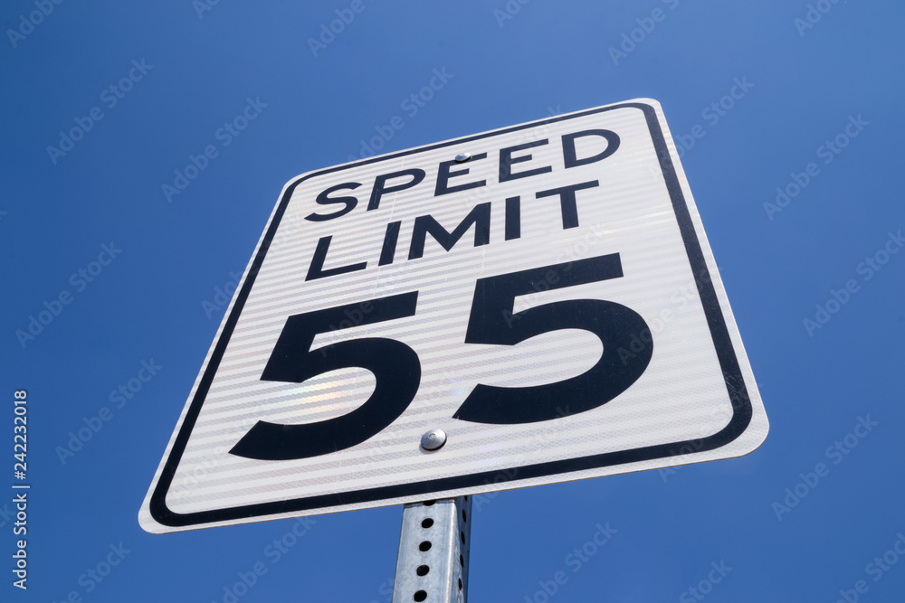 The fifty-five miles per hour street sign in the California sun. The fifty-five miles per hour street sign in the California sun.