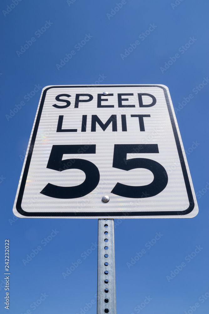 The fifty-five miles per hour street sign in the California sun. The fifty-five miles per hour street sign in the California sun.
