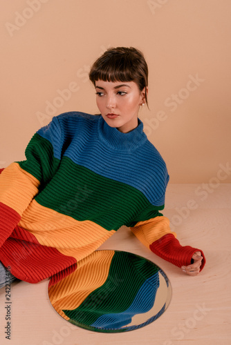 girl in bright colored sweater