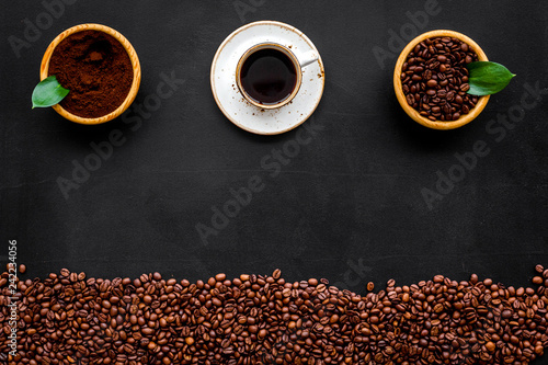 Fototapeta Naklejka Na Ścianę i Meble -  coffee background with beans and cup of americano black table flat lay space for text