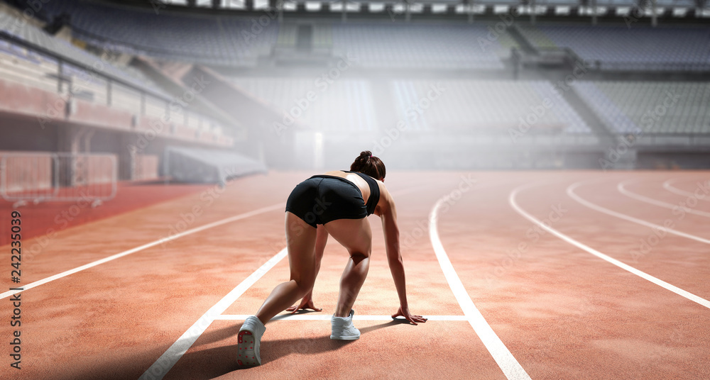 Fototapeta premium Sportswoman running race. Mixed media