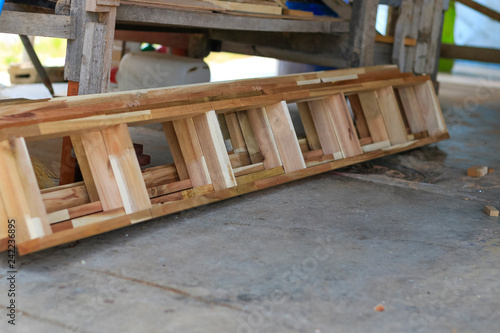 Carpenters are using tools with wood working furniture.