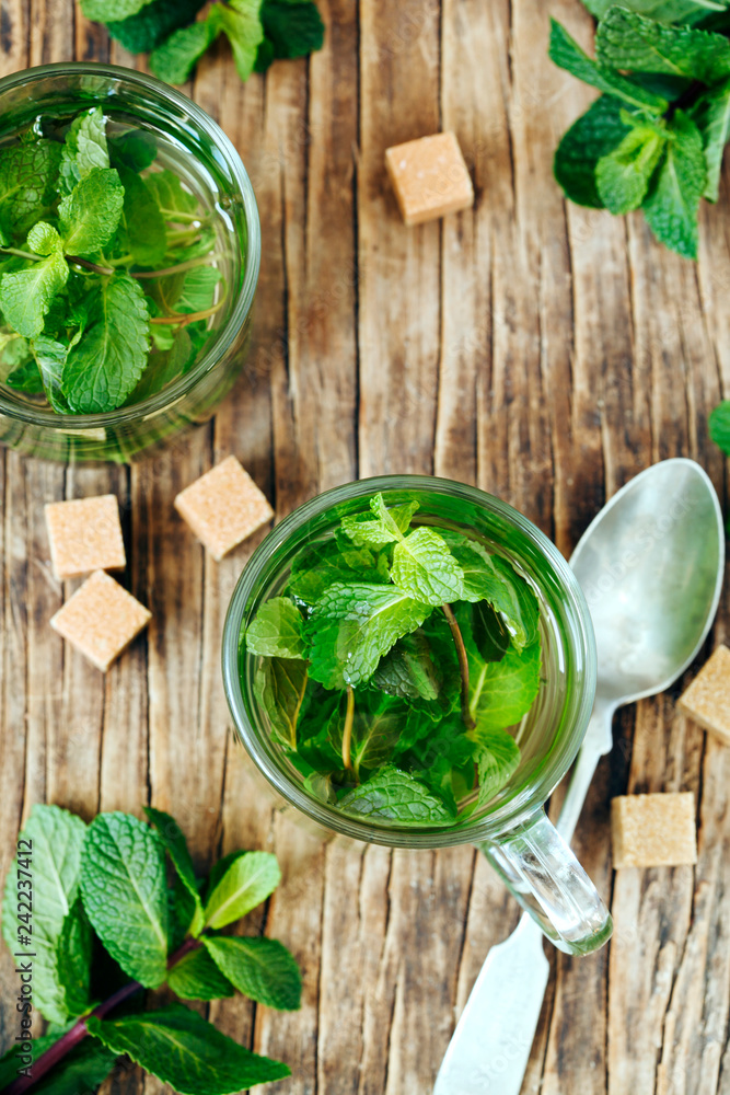 Cup of Mint tea on wooden background Cup of Mint tea on wooden background