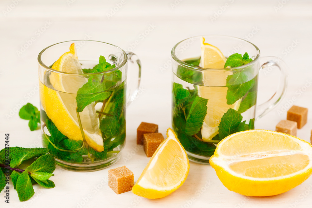 Two Cups of Mint tea on white background. Two Cups of Mint tea on white background.