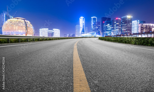 Road Pavement and Night View of Hangzhou Urban Architecture..