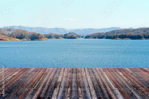 Empty wood floor with beatiful mountain dam landscape in Thailand.