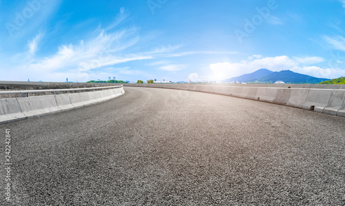 Empty asphalt road square and natural landscape under the blue sky