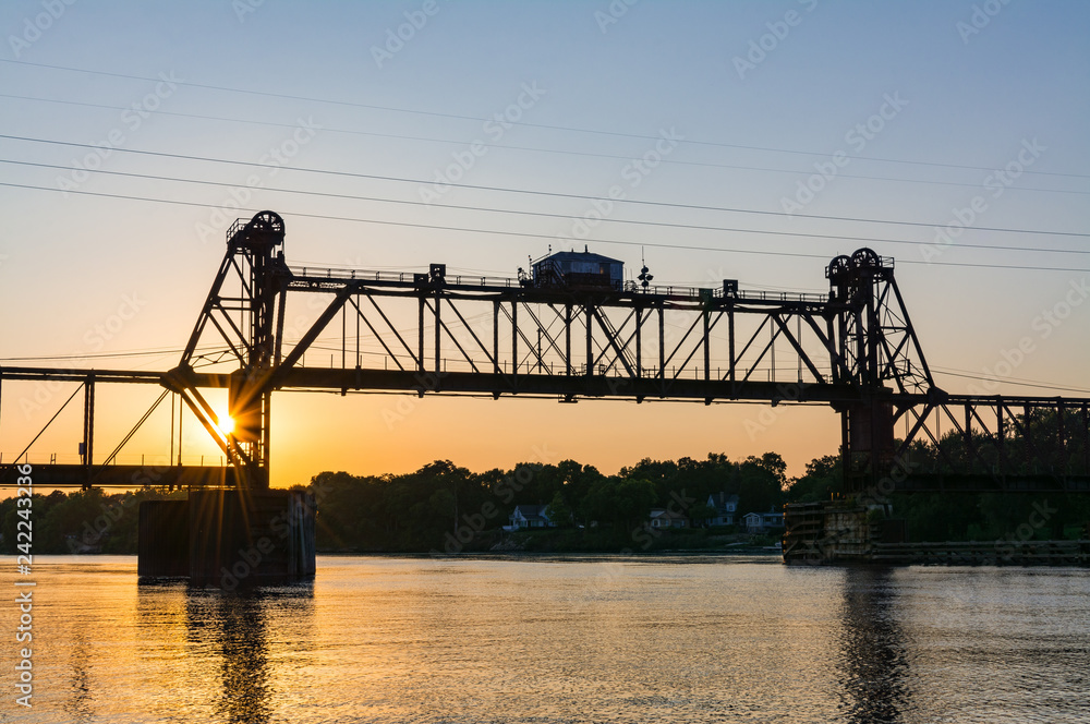 Ottawa Railroad Bridge as the sun sets on the Illinois River.  Ottawa, Illinois, USA