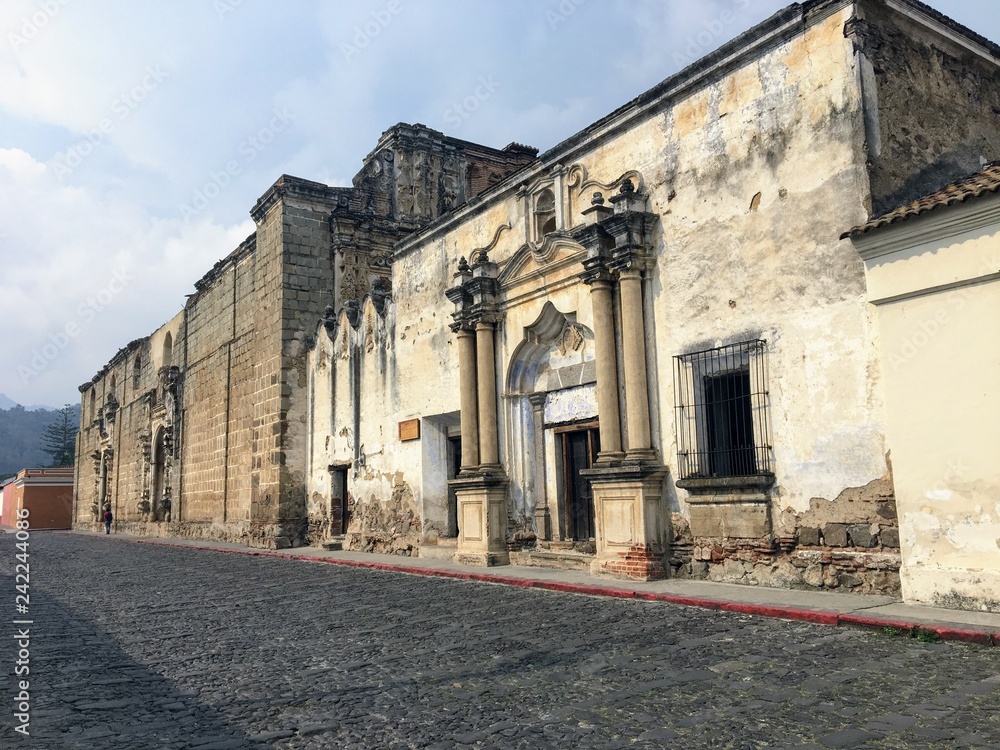 Old, decaying colonial architecture seen from the cobbled streets of the beautiful town of Antigua Guatemala, Guatemala.  A great place to visit for tourists exploring Guatemala and Central America.