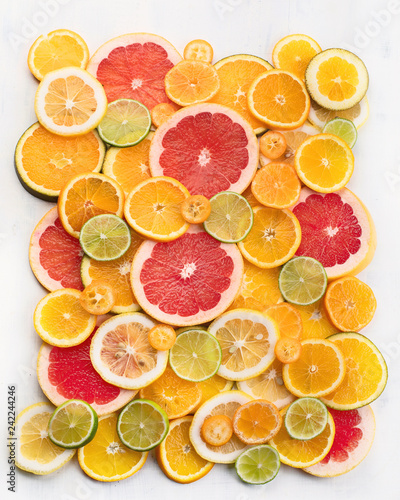 Fresh citrus fruits colorful background